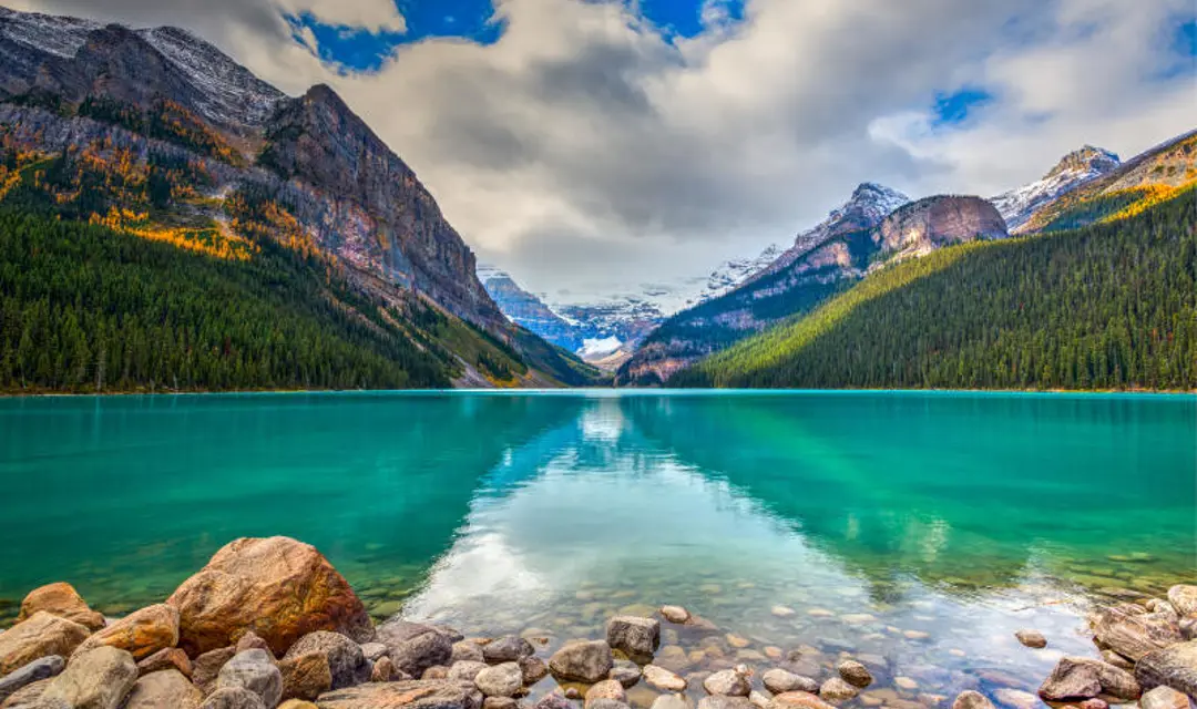 A panoramic view of Lake Louise with mountains in the background
