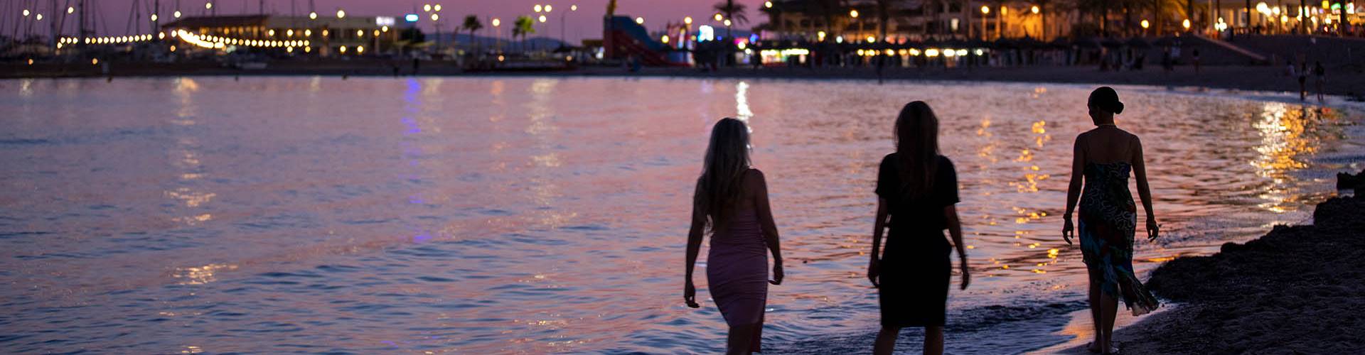Just You group on beach at night