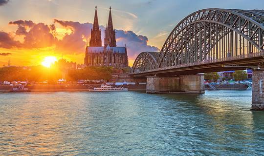 Sun setting behind Cologne Cathedral, Germany