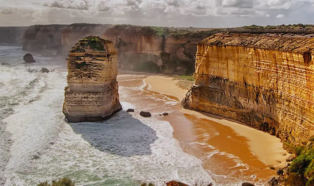Waves crashing against the shore and cliffs