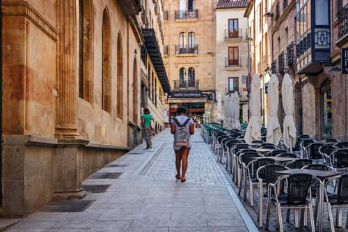 Woman walking in a street in Salamanca