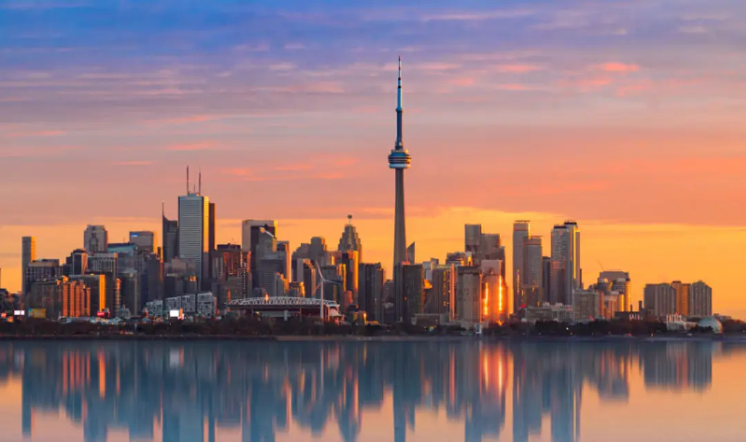 A dramatic view of Toronto's skyline at sunset