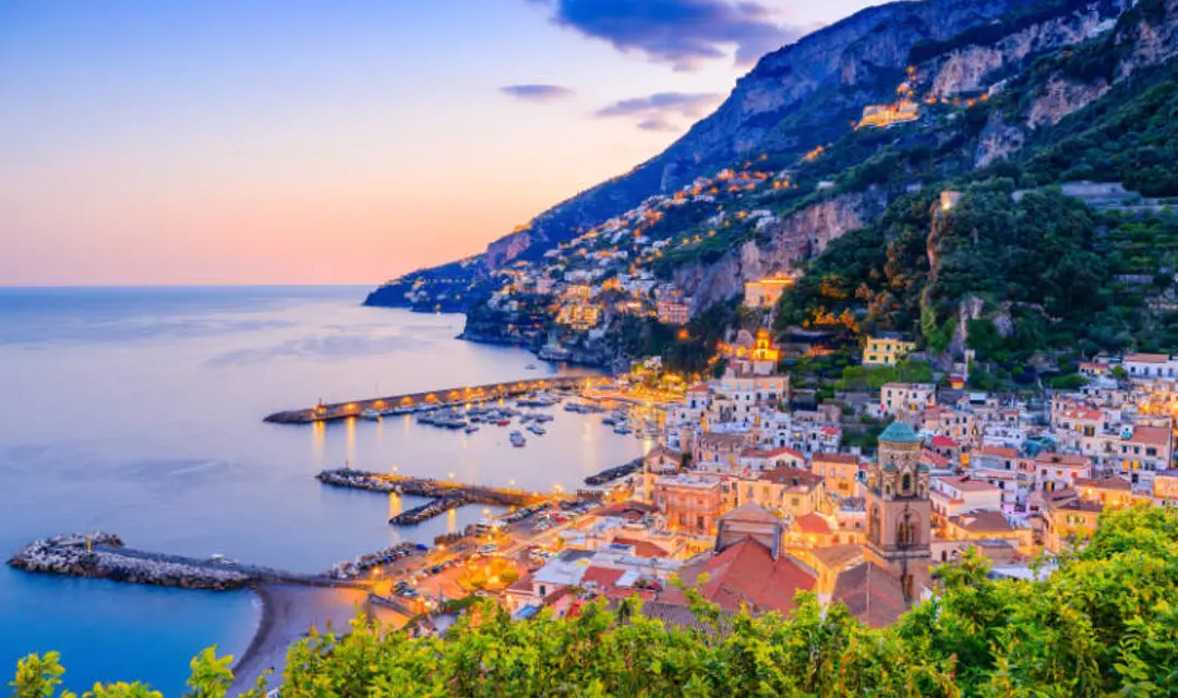 A sunset view of Amalfi's coastline in Italy
